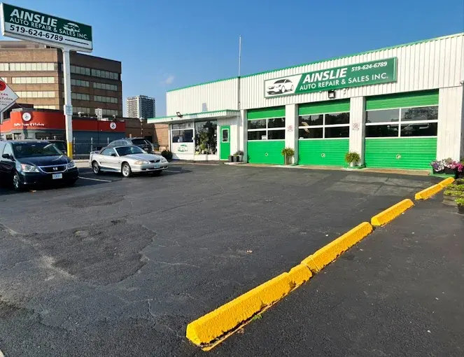 The Ainslie Auto lot, with the office door to the left of the three green bay doors